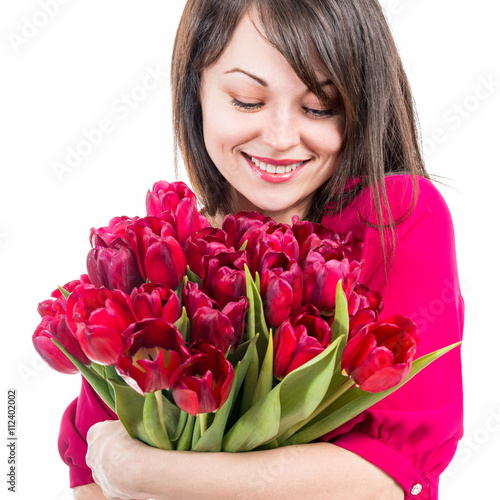 Portrait of beautiful cheerful woman with tulips