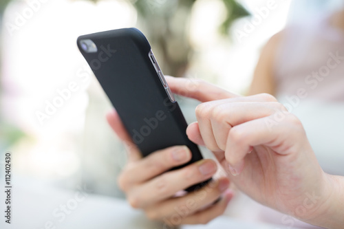 Woman sending sms on phone
