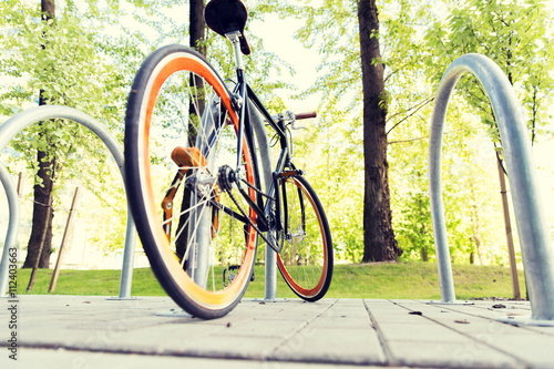 Vászonkép close up of bicycle locked at street parking