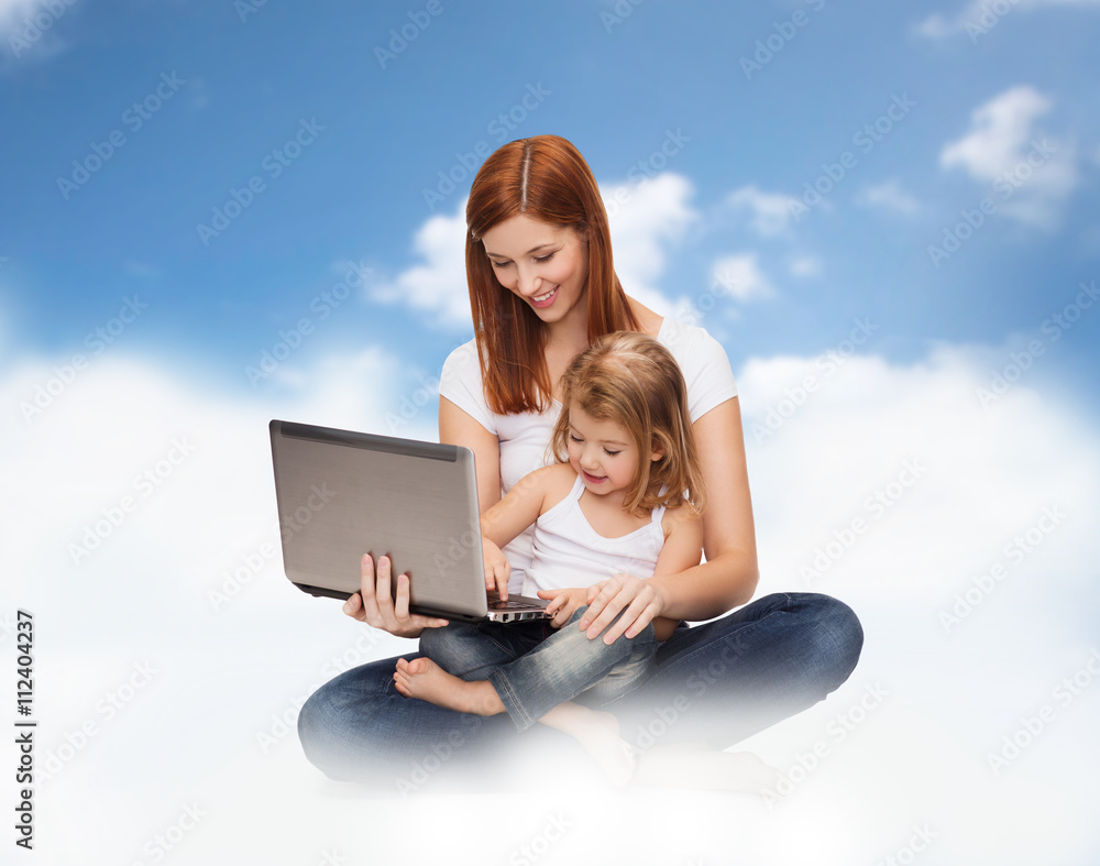 happy mother with adorable little girl and laptop happy mother with adorable little girl and laptop