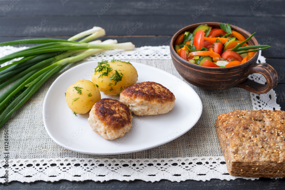 Cutlets home with boiled potatoes