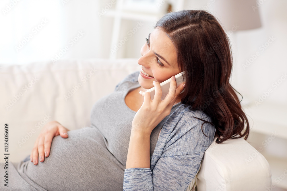 happy pregnant woman calling on smartphone at home happy pregnant woman calling on smartphone at home
