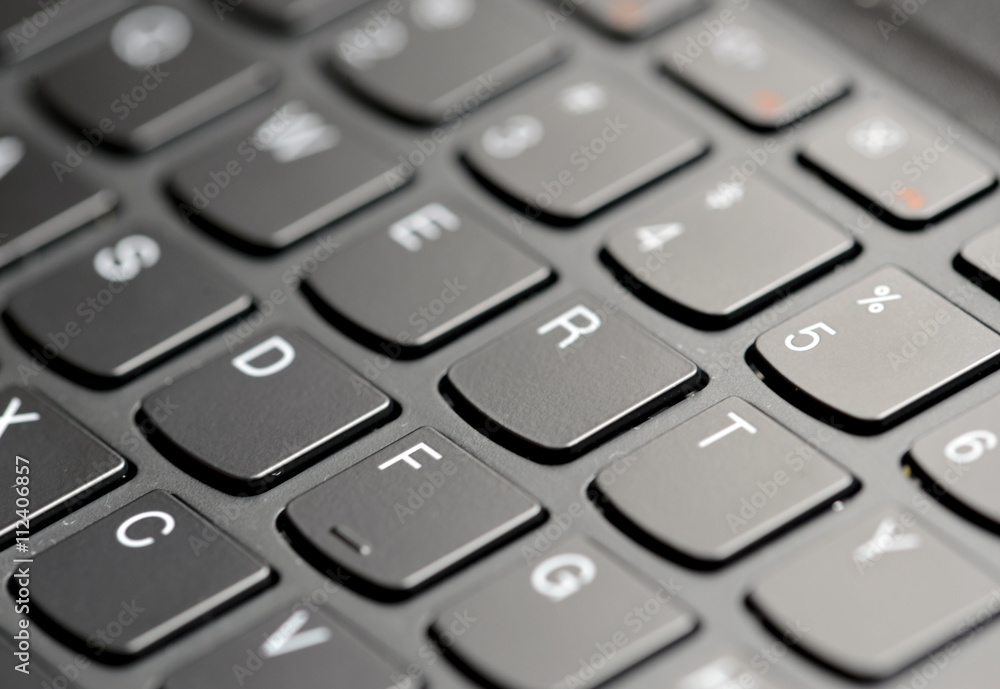 Closeup of computer keyboard keys with narrow focus and selectively blurred background Closeup of computer keyboard keys with narrow focus and selectively blurred background