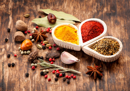 Fototapeta Naklejka Na Ścianę i Meble -  Seasonings, spices on a wooden background