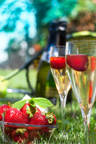 Strawberries with whipped cream and champagne on Wimbledon tennis tournament
