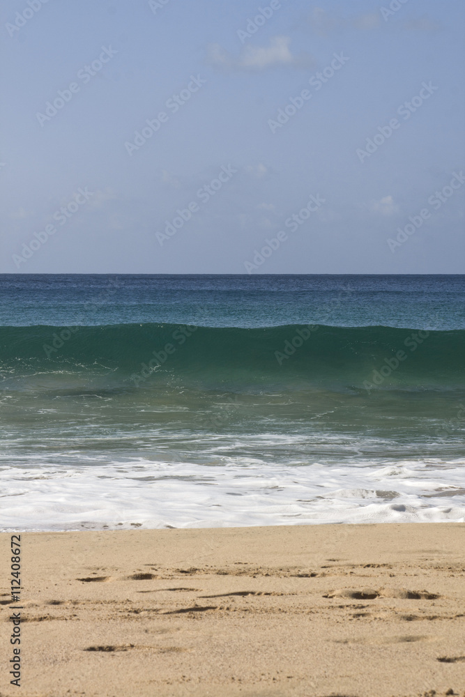 Detail of wave crushing at the beach seashore