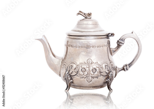 Antique silver teapot isolated on white with a clipping path.