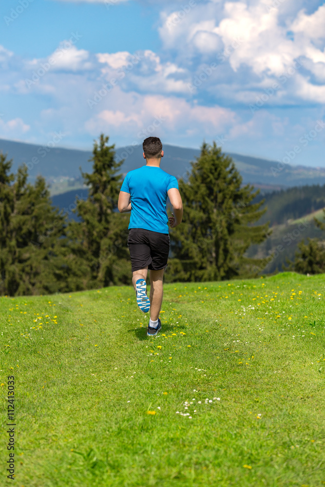 Running fitness man sprinting outdoors in beautiful landscape. Running fitness man sprinting outdoors in beautiful landscape.