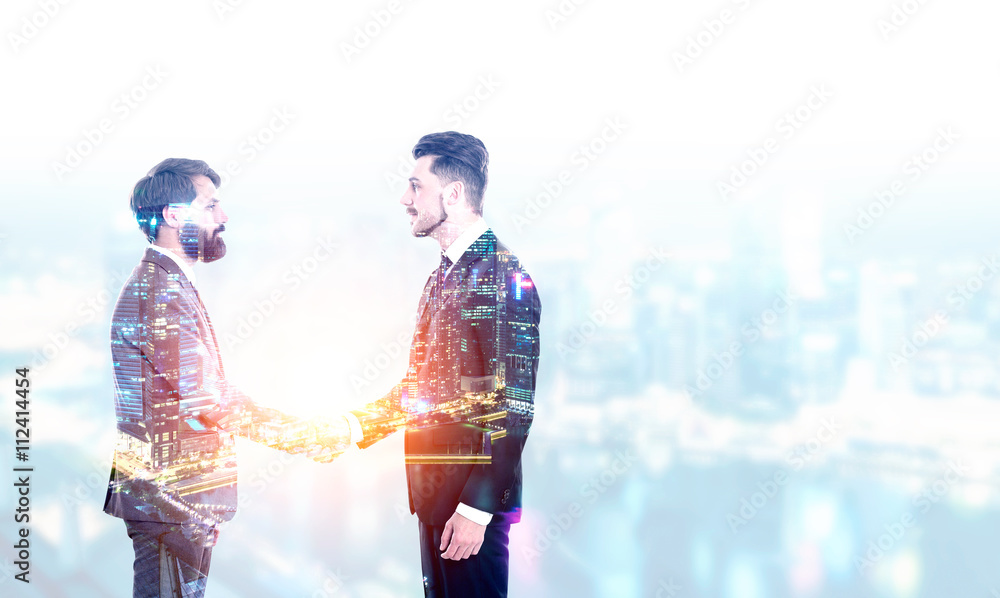 Naklejka premium Man shaking hands multiexposure