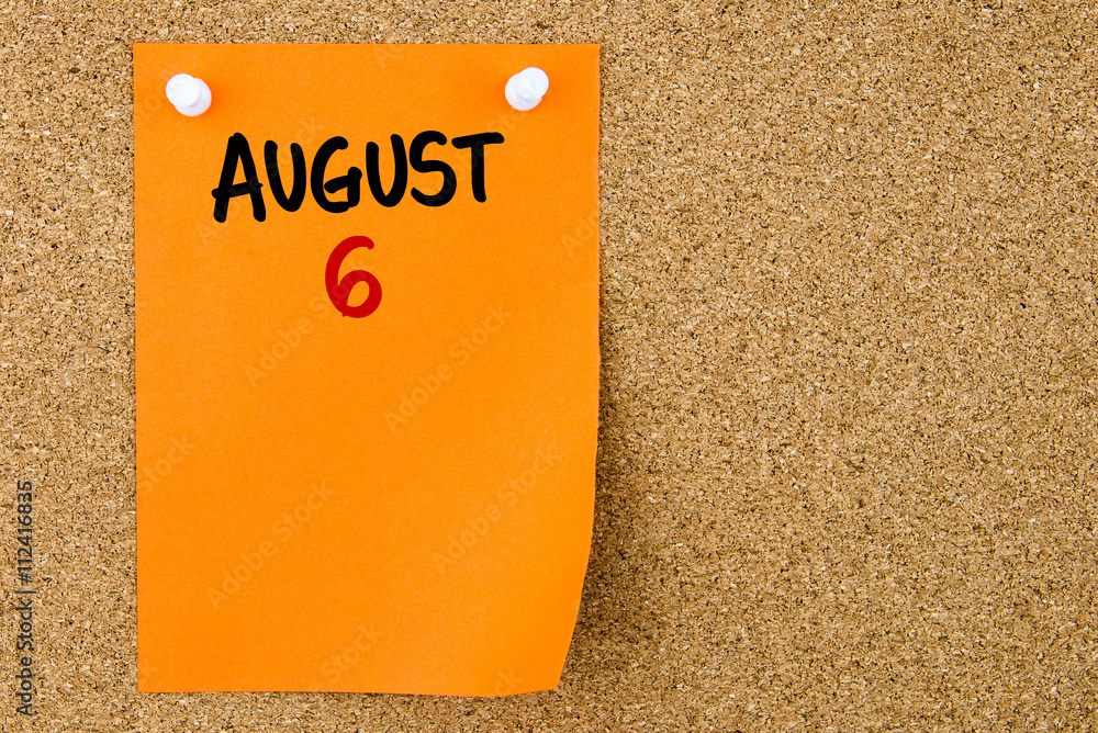 6 AUGUST written on orange paper note