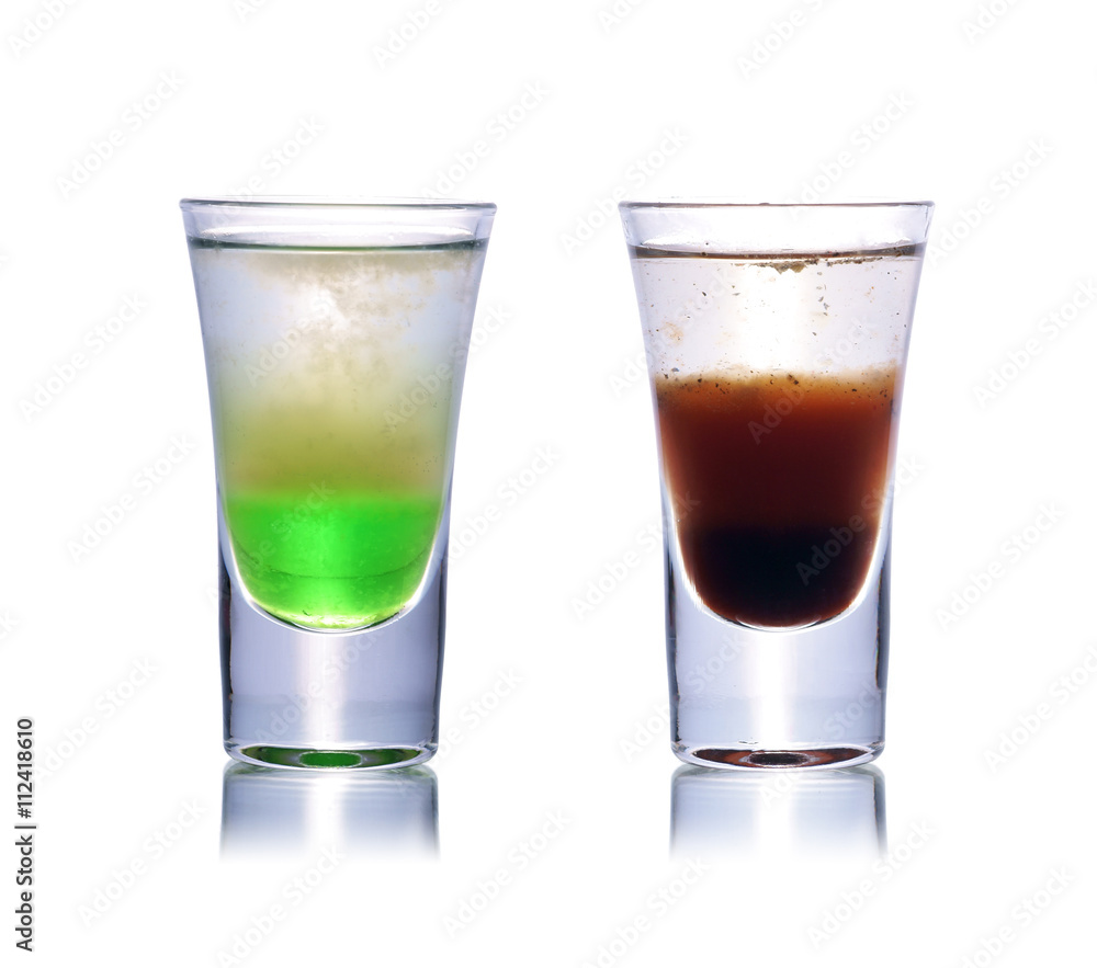 Set of colorful alcoholic cocktails in shot glasses isolated on white with reflection. Colletion of shooters Set of colorful alcoholic cocktails in shot glasses isolated on white with reflection. Colletion of shooters