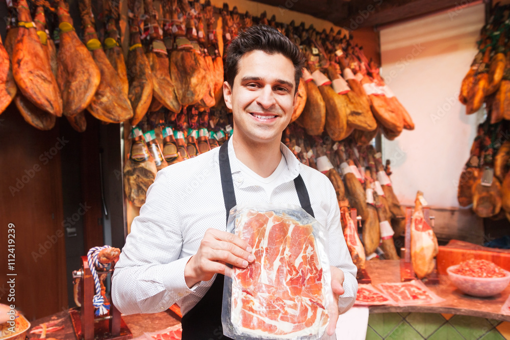 Fototapeta premium salesperson in the store jamon