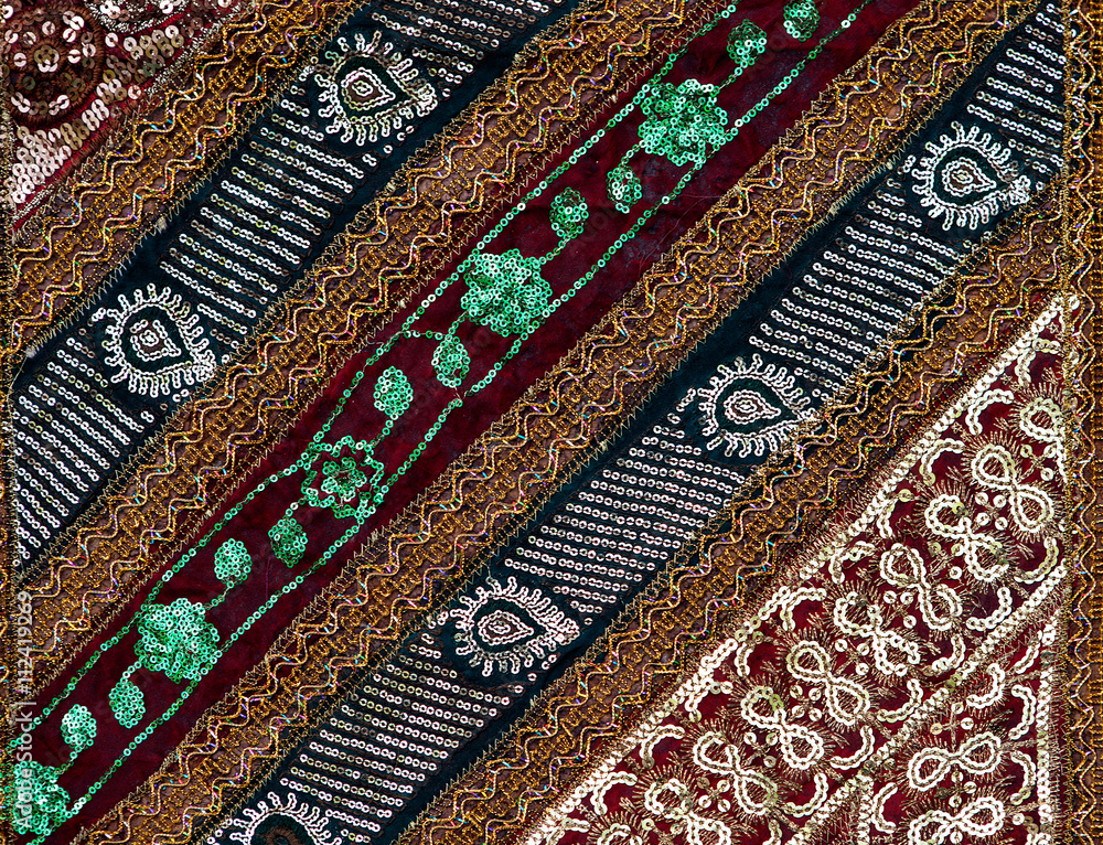 Fragment of colorful retro tapestry textile pattern with floral ornament useful as background Fragment of colorful retro tapestry textile pattern with floral ornament useful as background