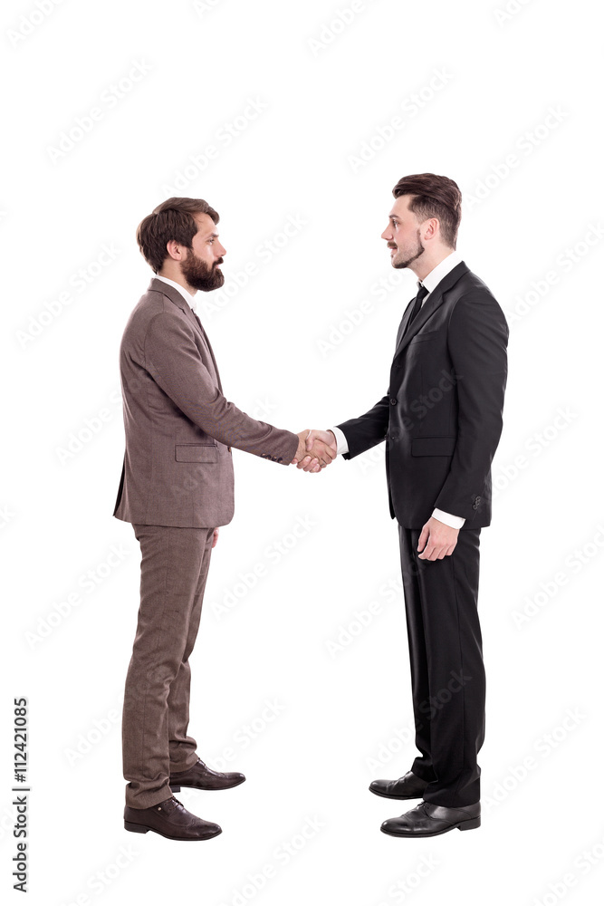 Isolated businessmen shaking hands Isolated businessmen shaking hands