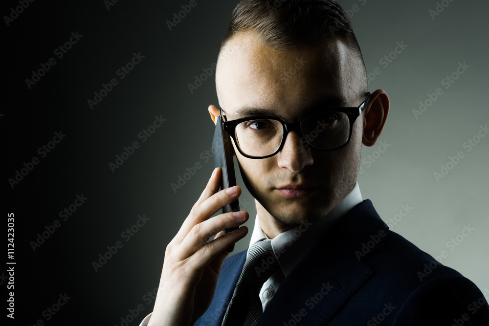 Guy in glasses with mobile phone Guy in glasses with mobile phone
