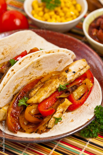 Fajita Chicken Tacos with Grilled Onions and Bell Peppers. Selective focus.