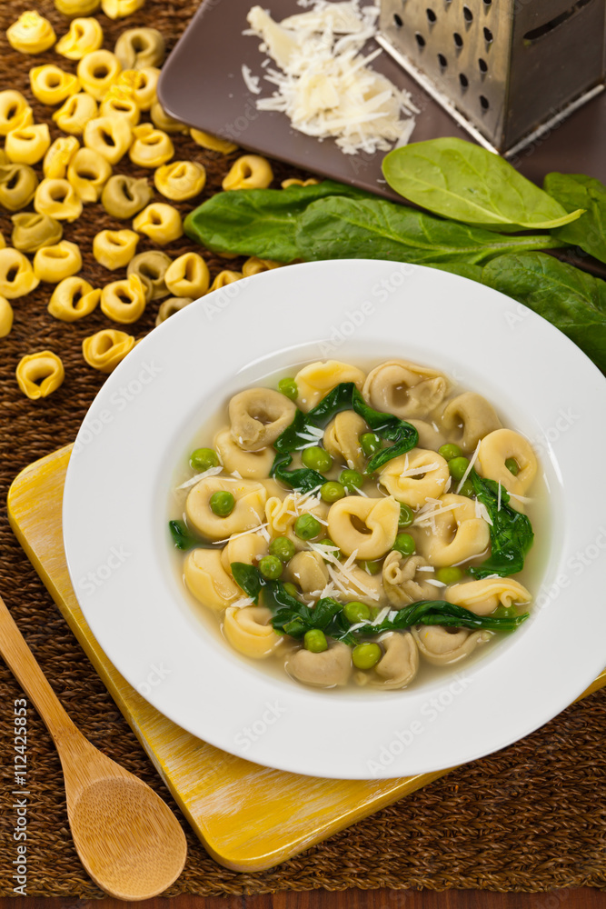 Tortellini Soup with Peas and Spinach. Selective focus. Tortellini Soup with Peas and Spinach. Selective focus.