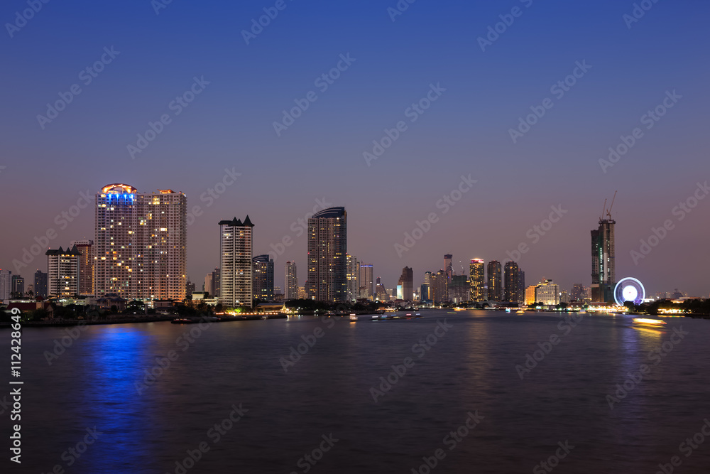 Chao phraya river and Bangkok cityscape at twilight