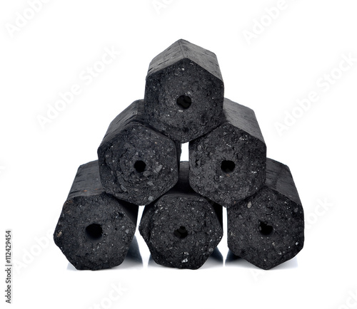 Hardwood charcoal isolated on white. photo