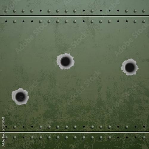 Holes from the shots on the green plate of armor metal. Stock ve