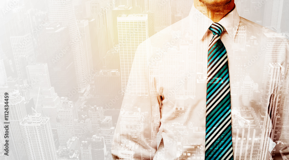 Business person with warm color overlay of city background Business person with warm color overlay of city background