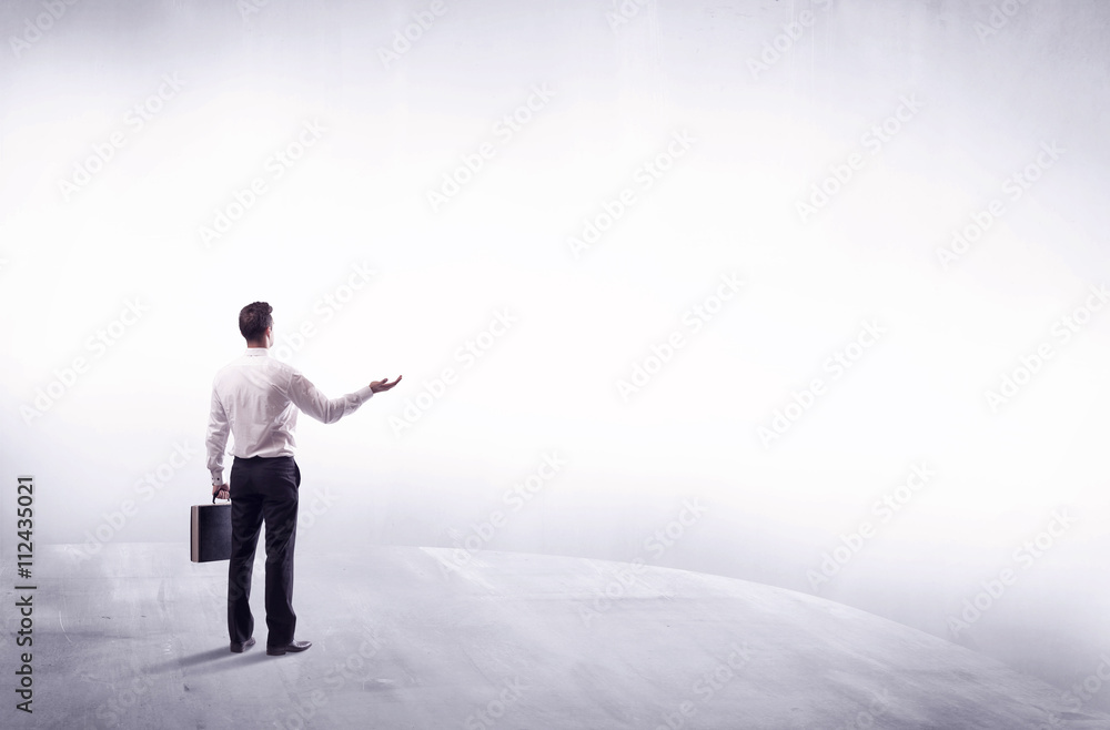 Business person standing from rear view Business person standing from rear view