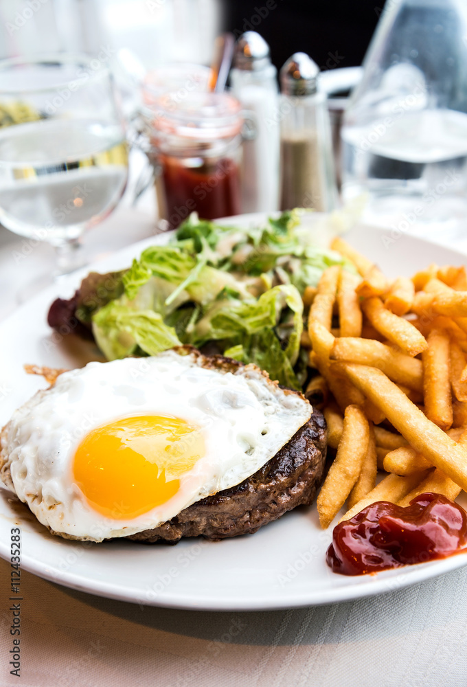 Egg and fries - classical english breakfast with egg and fries Egg and fries - classical english breakfast with egg and fries