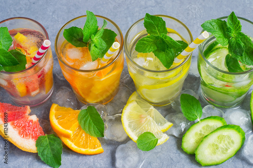 Refreshing Detox summer drinks water with ice and citrus and cuc