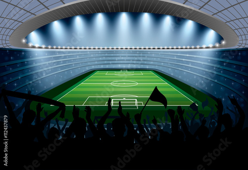 Excited crowd of people at a soccer stadium. Football stadium.