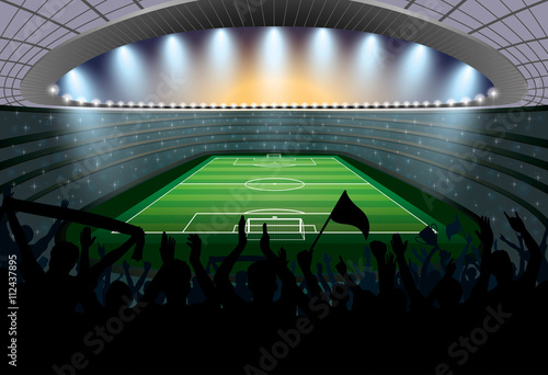 Excited crowd of people at a soccer stadium. Football stadium.