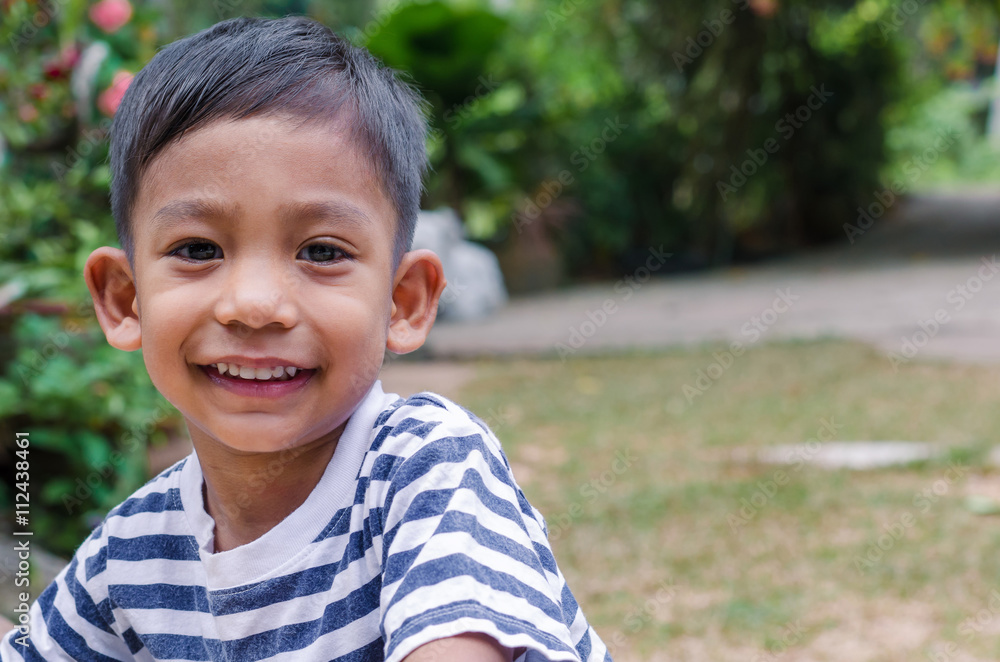 Asian Child Posing with Gentle Smile. Asian Child Posing with Gentle Smile.