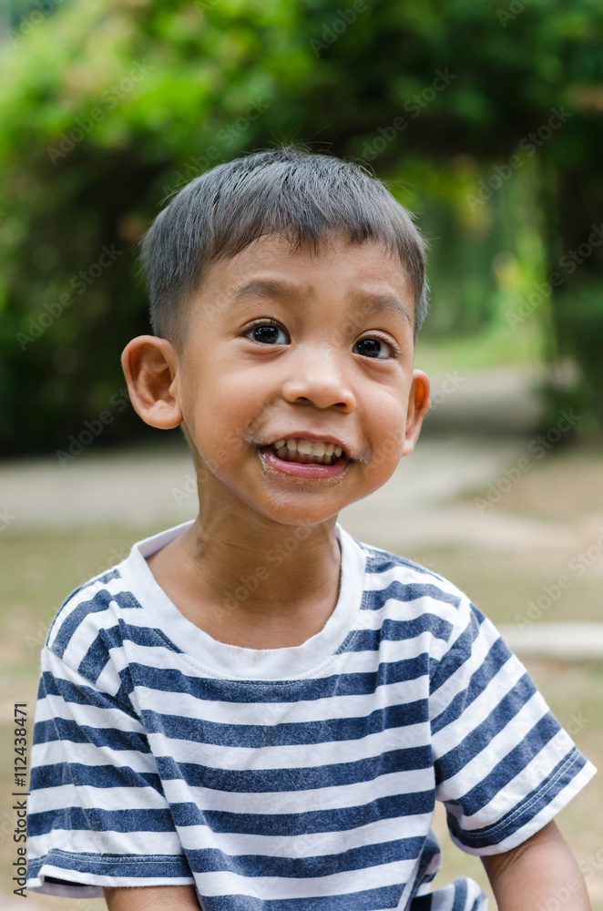 Asian Child Posing with Gentle Smile. Asian Child Posing with Gentle Smile.
