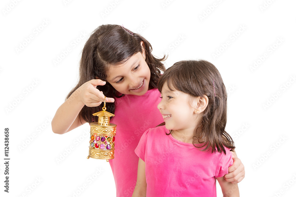 Two Muslim sisters celebrating Ramadan