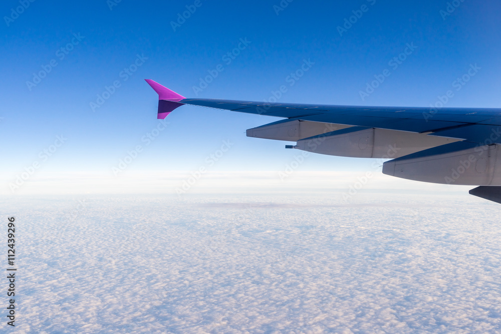 Obraz premium view of planet earth from an airplane through the window