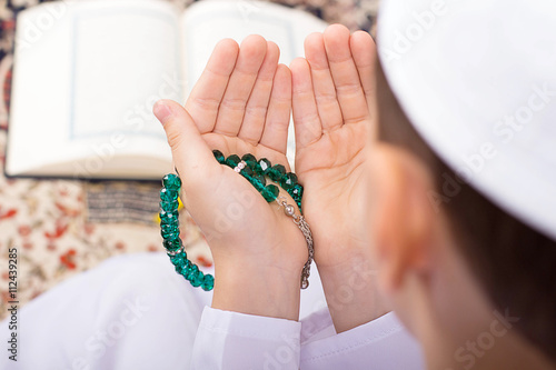 Little Muslim kid making duaa in Ramadan