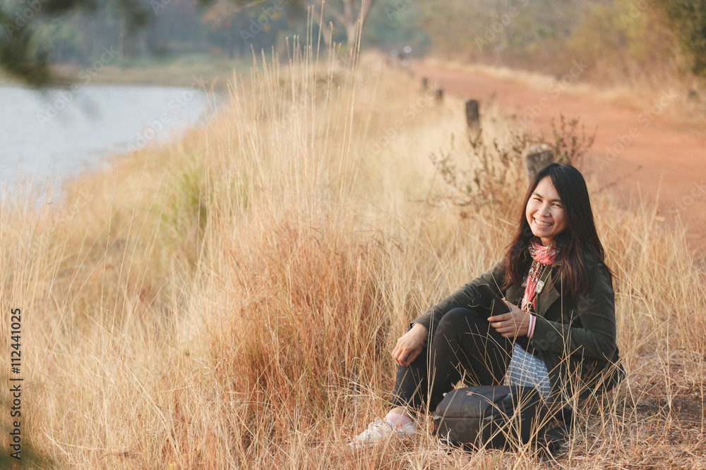 Happiness woman enjoy sit at grassland