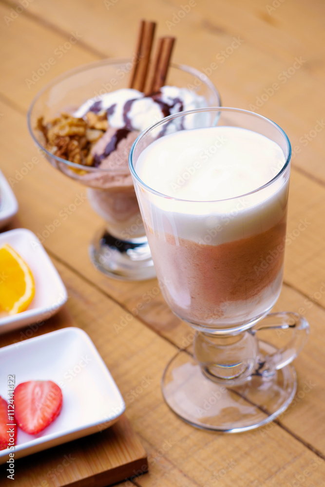 Coffee latte, ice scream and sliced fruits Coffee latte, ice scream and sliced fruits