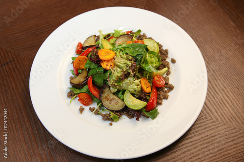 Fresh salad with chicken, tomatoes and mixed greens