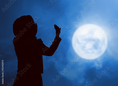 Silhouette woman praying