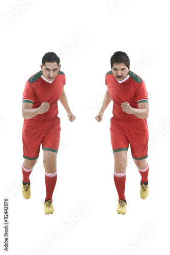 Two asian football player running © Leo Lintang