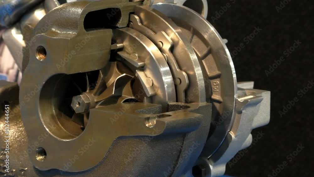 Diesel car engine cut open turbocharger showing working parts Diesel car engine cut open turbocharger showing working parts