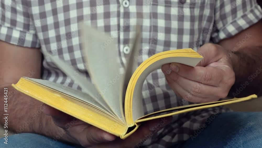Video of a man leafing through the book quickly. 4K Stock Footage Clip
Video of a man leafing through the book quickly. 4K Stock Footage Clip