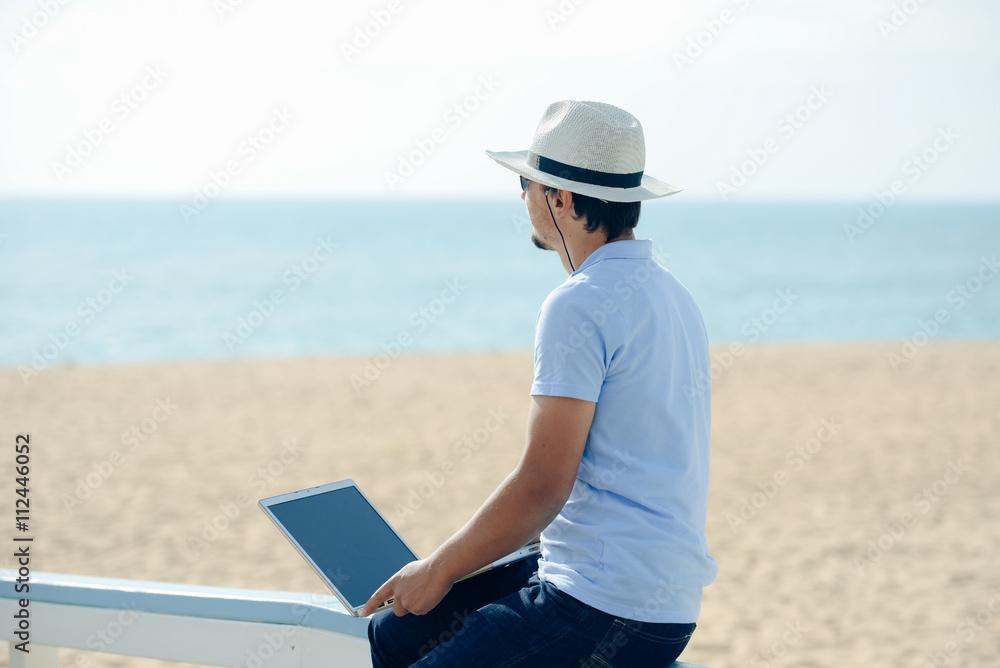 Side view of businessman enjoying working outside talking on phone