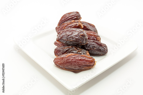 Date fruits in white plate - Ramadan, Eid background