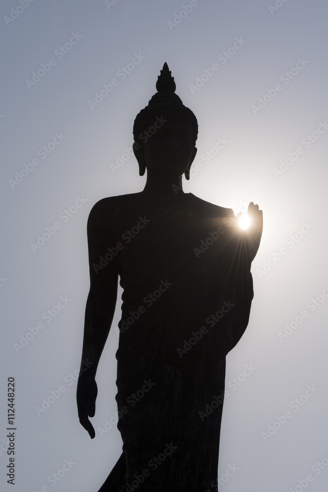 Silhouetteat of Buddha on sunset time