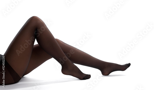 Sexy woman legs with stockings isolated on a white background.