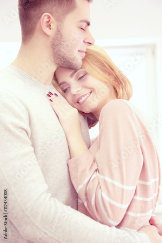 Young couple in love embrac...
