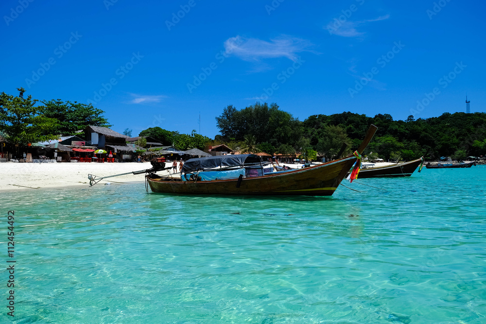 fishing boat against clear sea and blue sky fishing boat against clear sea and blue sky