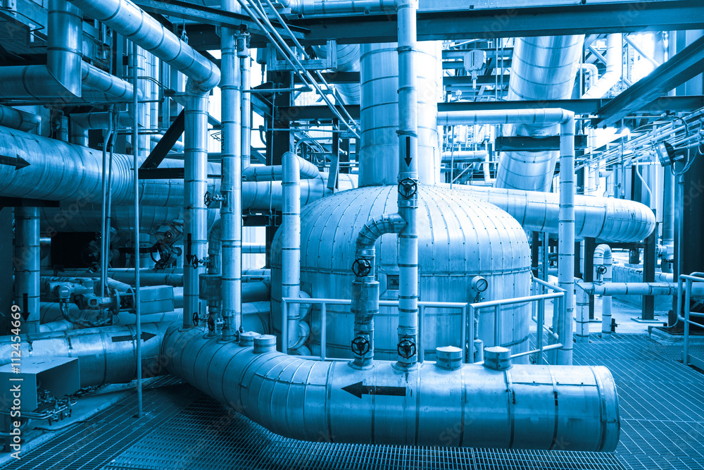 Equipment, cables and piping as found inside of combined cycle power plant (Blue tone) Equipment, cables and piping as found inside of combined cycle power plant (Blue tone)