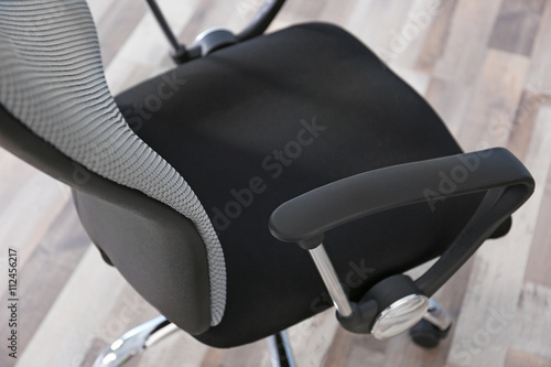 Canvastavla New office chair on the floor, closeup